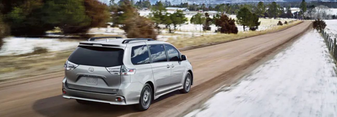 2020 Toyota Sienna driving through snowy landscape